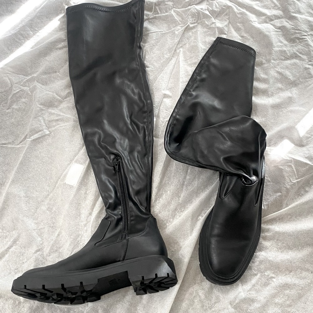 Black leather thigh high boots